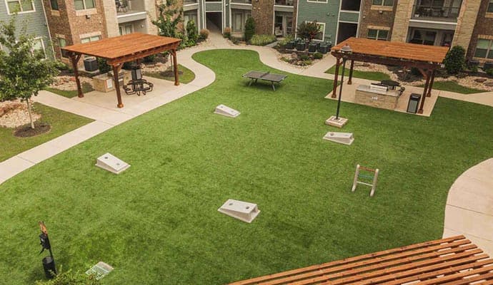 Residential artificial turf installation in Arlington, TX - Beautiful green synthetic grass lawn